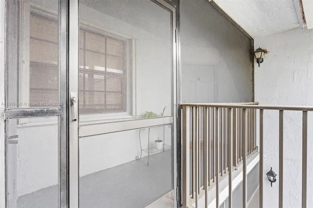 a view of porch with a potted plant