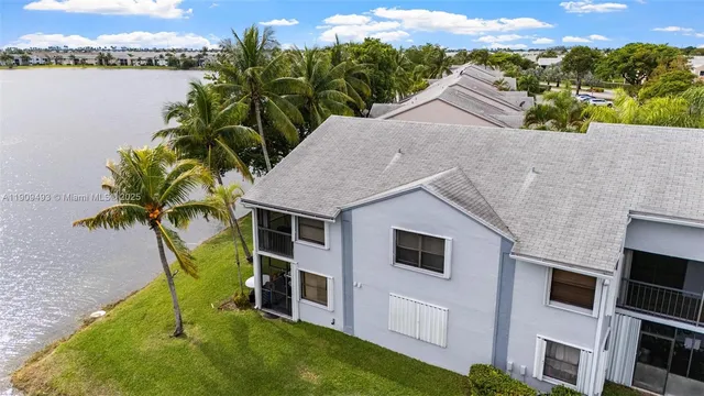 an aerial view of residential house with outdoor space and swimming pool