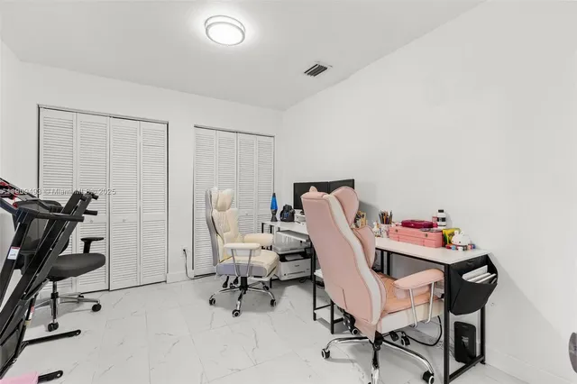 a bathroom with a sink mirror and vanity