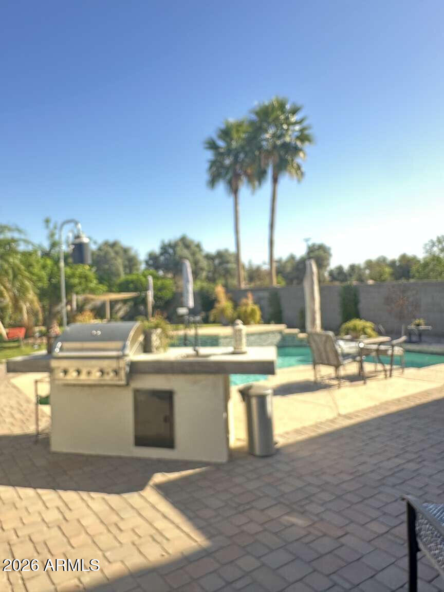2576 East Brooks Street Gilbert, AZ 85296 - Photo 3 of 18 a view of a swimming pool and a terrace