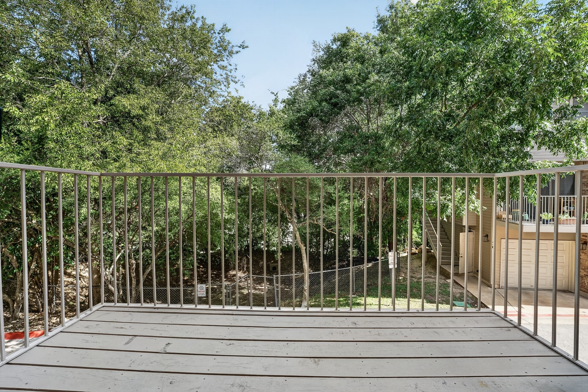 3845 Ranch Road 2222, Unit 32 Austin, TX 78731 - Photo 21 of 24 Private balcony to enjoy the lush greenery that surrounds this unit
