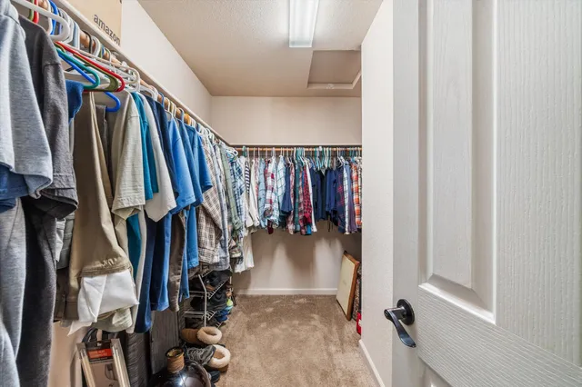 a kitchen with a sink stainless steel appliances and cabinets
