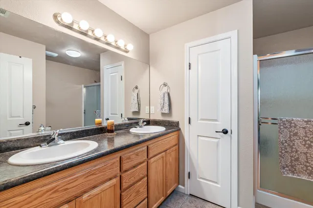 a spacious bedroom with a bed and a window