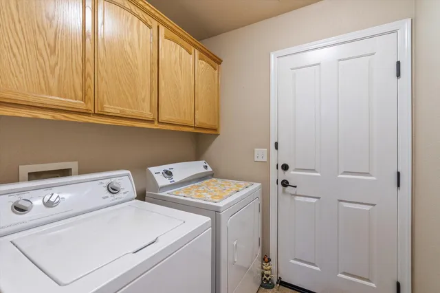 a bathroom with a granite countertop sink toilet and mirror