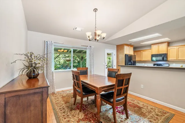 a living room with furniture ceiling fan and a rug