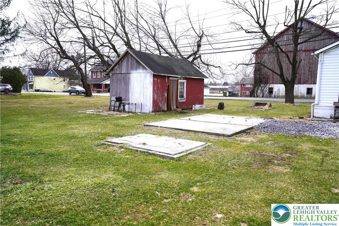 3863 Mauch Chunk Road Coplay, PA 18037 - Photo 30 of 33 a view of a house with a yard and tree s