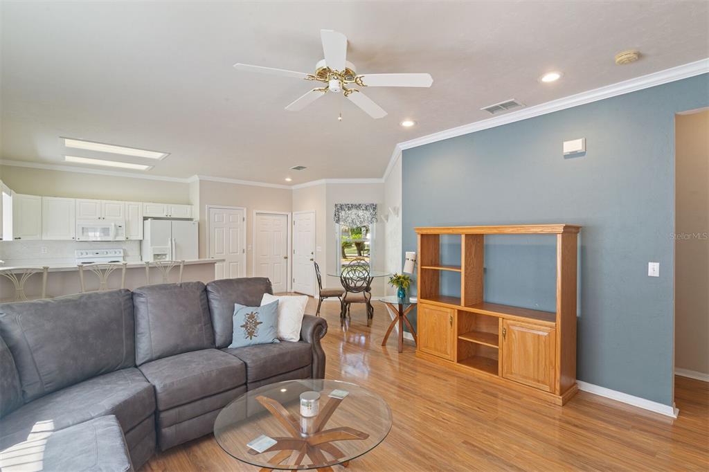 4748 Northwest 77 Road Gainesville, FL 32653 - Photo 11 of 21 a living room with furniture and a wooden floor