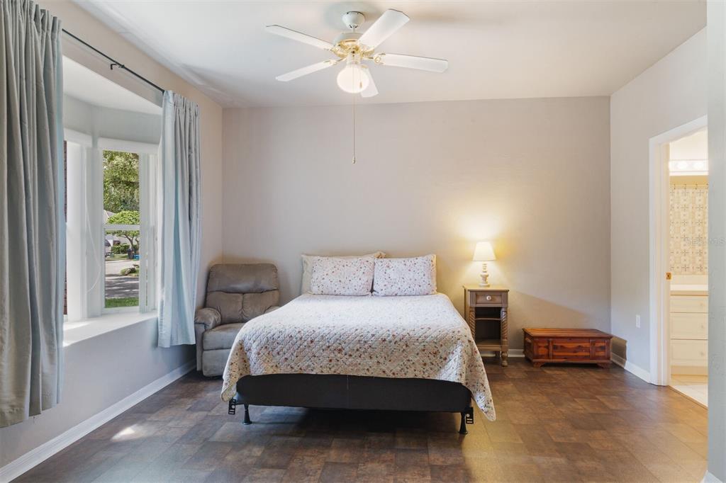 4748 Northwest 77 Road Gainesville, FL 32653 - Photo 15 of 21 a bedroom with a bed and a window