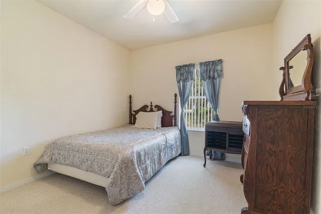 a bedroom with a bed and a table in it