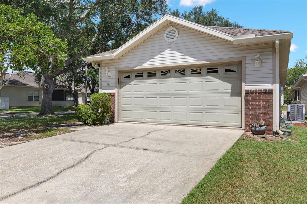 4748 Northwest 77 Road Gainesville, FL 32653 - Photo 20 of 21 a front view of a house with a yard and garage