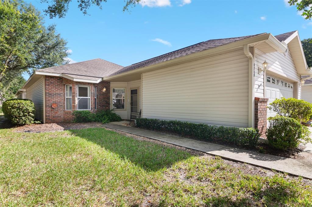 4748 Northwest 77 Road Gainesville, FL 32653 - Photo 2 of 21 a front view of a house with garden