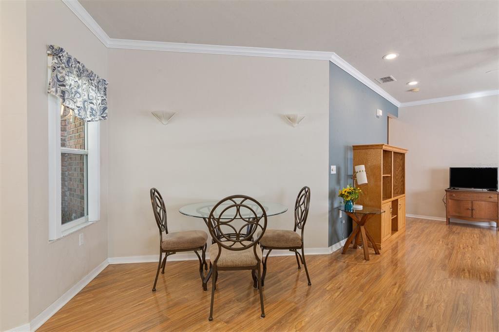 4748 Northwest 77 Road Gainesville, FL 32653 - Photo 9 of 21 a view of a dining room with furniture and wooden floor