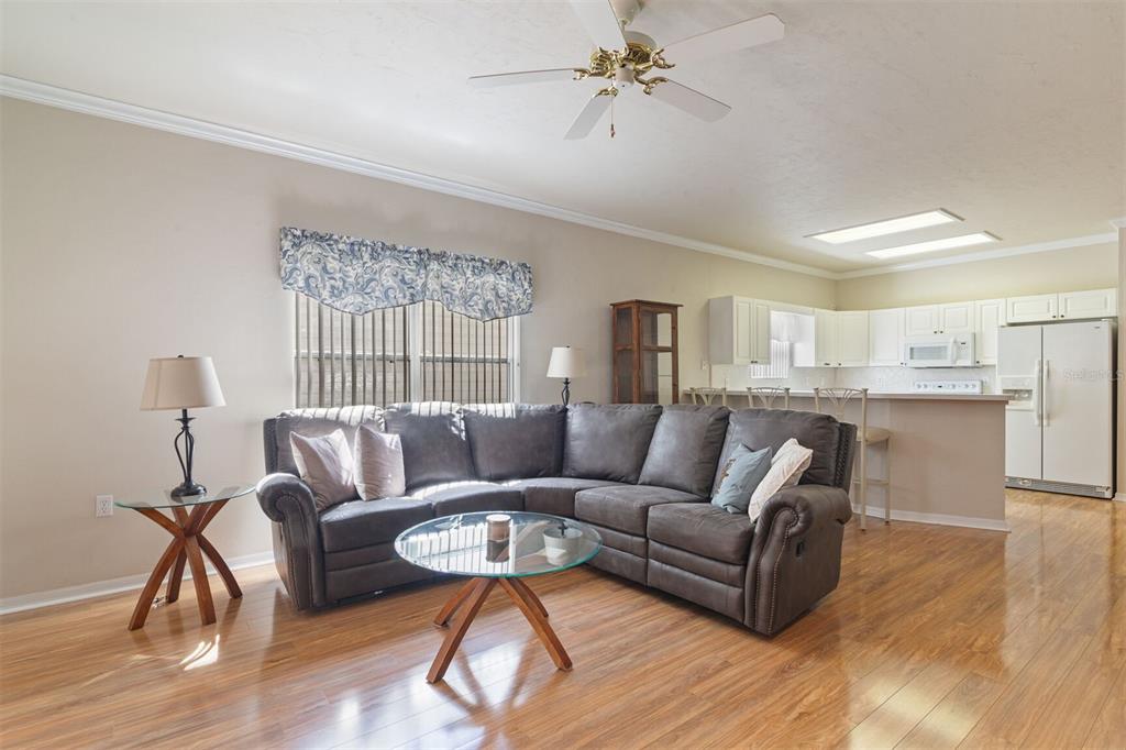 4748 Northwest 77 Road Gainesville, FL 32653 - Photo 10 of 21 a living room with furniture and a wooden floor