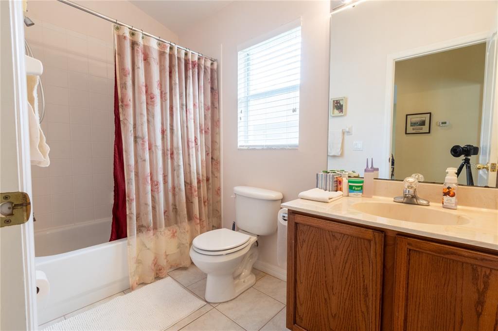 1812 Flower Branch Way Valrico, FL 33594 - Photo 26 of 42 a bathroom with a sink toilet and shower