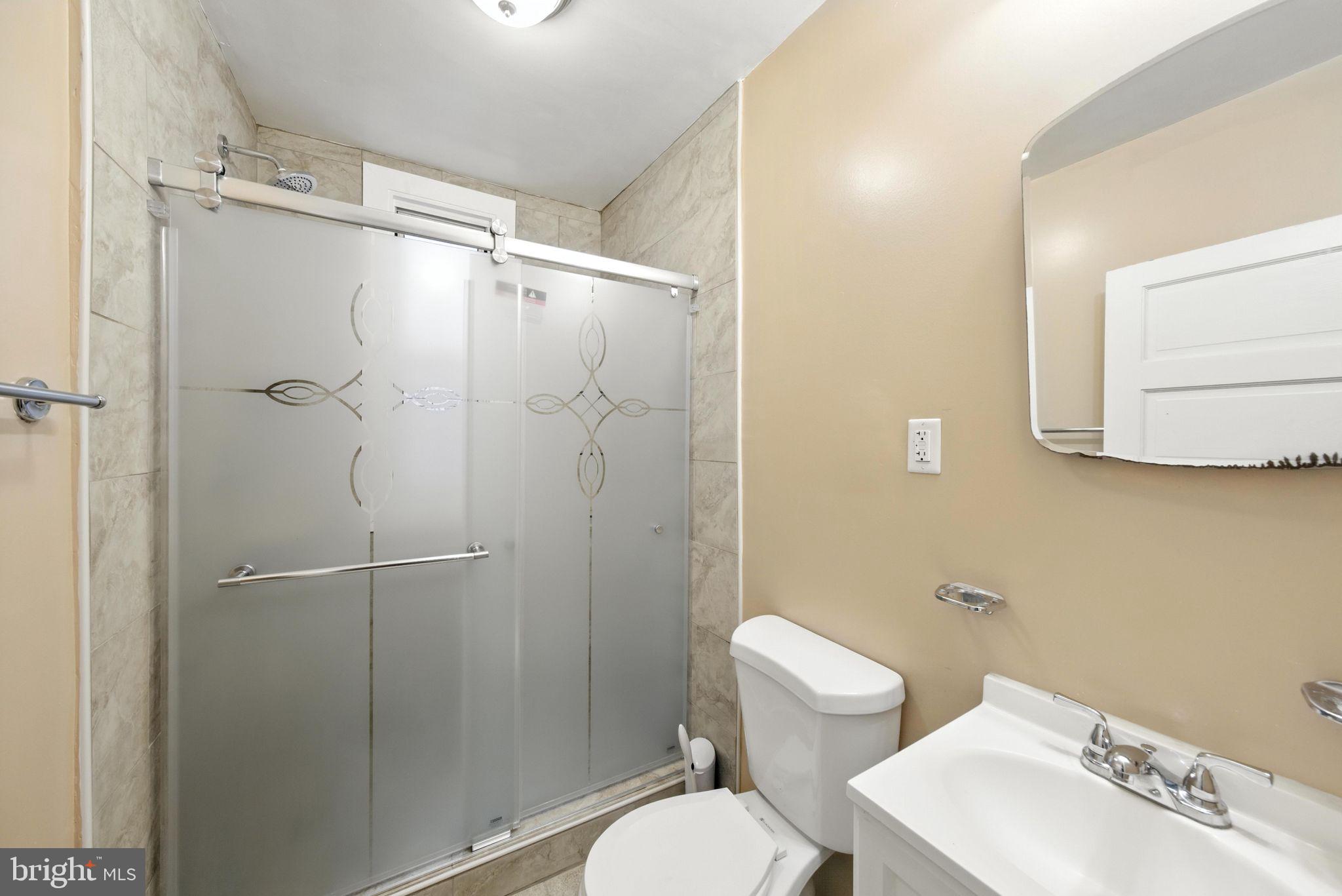 1763 U Street Northwest Washington, DC 20009 - Photo 17 of 29 a bathroom with a toilet a sink and shower