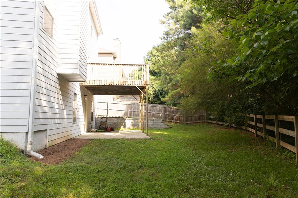 502 Streamside Place Canton, GA 30115 - Photo 29 of 33 a view of a house with backyard and porch