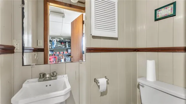 a bathroom with a sink and a window