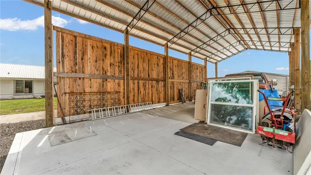 a view of front door with outdoor seating