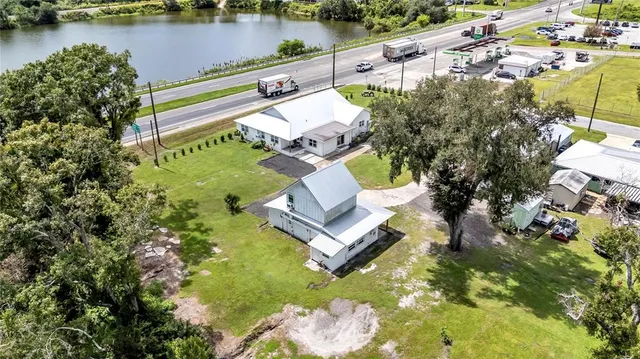 a aerial view of a house with a yard