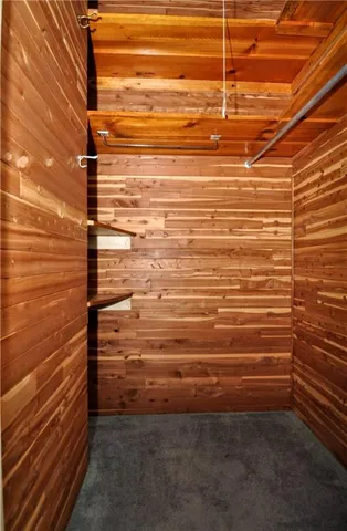 a view of a kitchen with a sink and chandelier