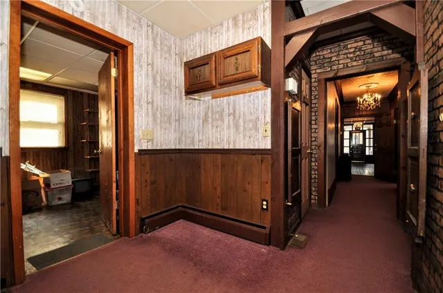 a bathroom with a toilet a sink and a window