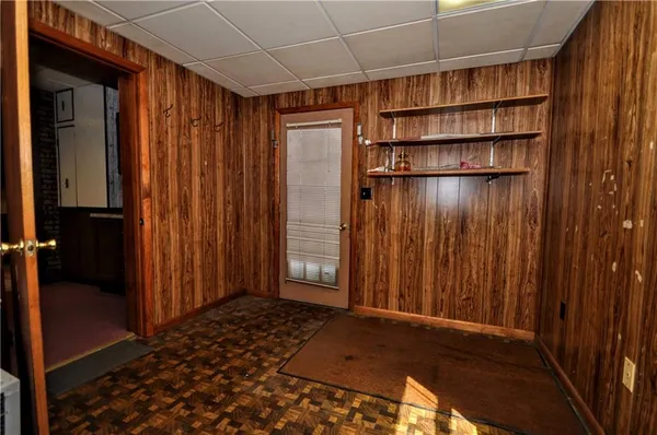 a view of staircase with wooden floor and white walls