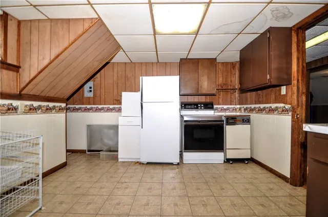 a view of storage and utility room with closet
