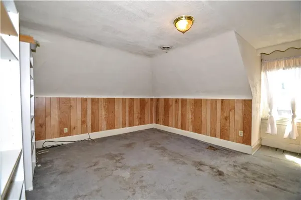 a view of entryway with wooden walls