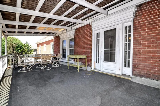 a view of an empty room with a fireplace