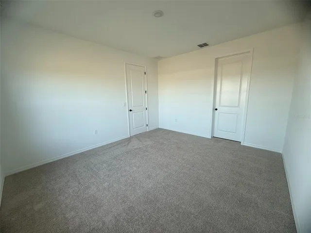 a bathroom with a double vanity sink mirror and shower