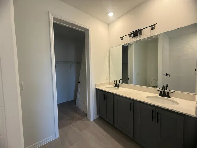a bathroom with a sink and mirror