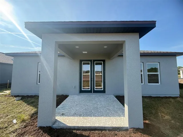 a view of a house with a garden