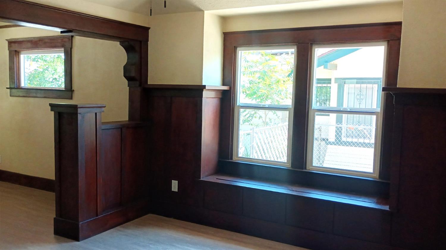 1327 North Ferger Avenue Fresno, CA 93728 - Photo 3 of 22 a view of an empty room with wooden floor and a window