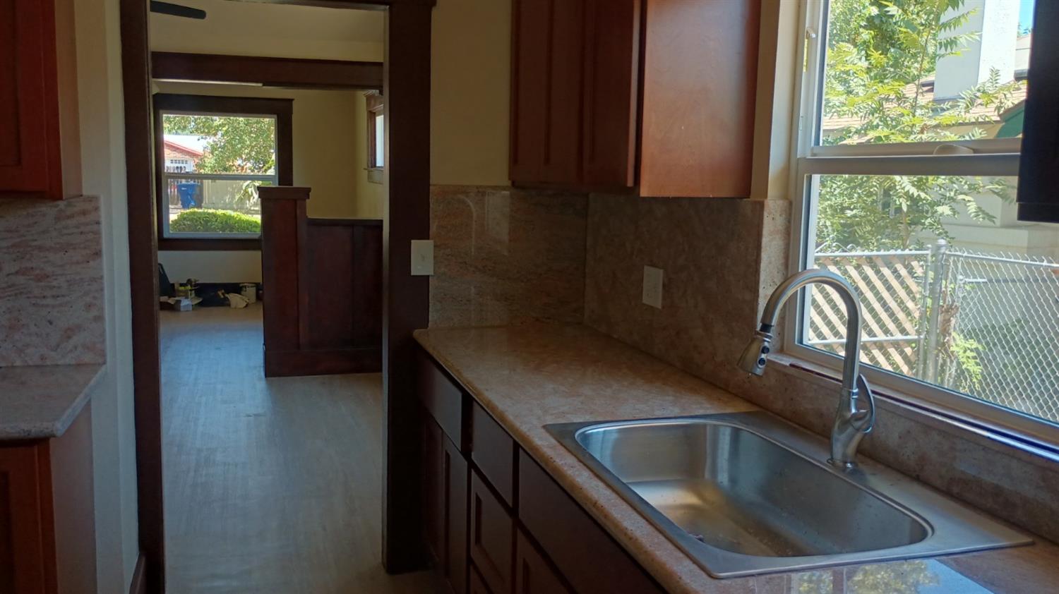 1327 North Ferger Avenue Fresno, CA 93728 - Photo 7 of 22 a kitchen with a sink and a window