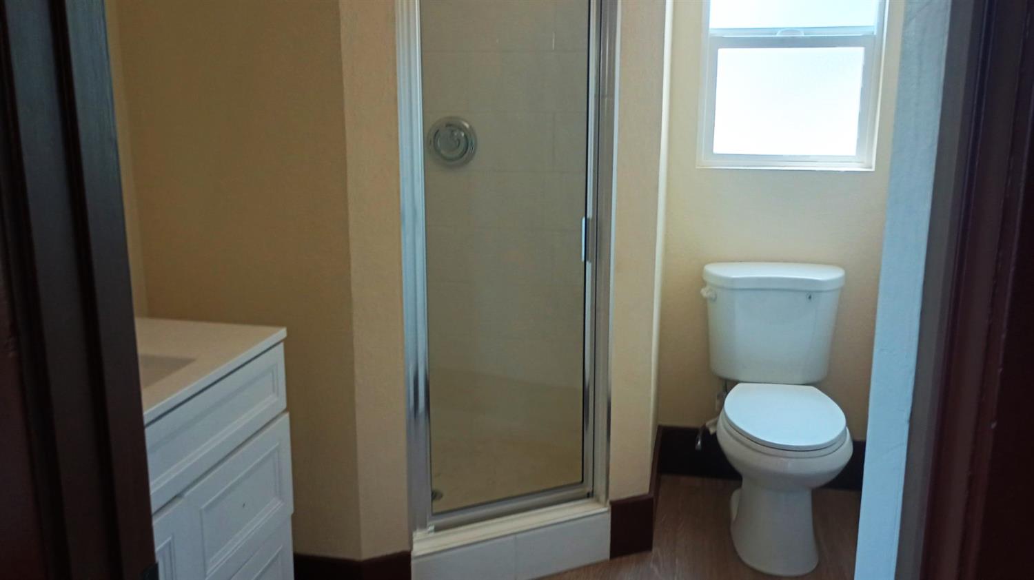 1327 North Ferger Avenue Fresno, CA 93728 - Photo 9 of 22 a bathroom with a toilet and a sink