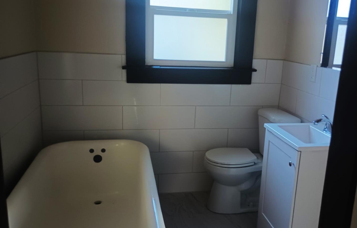 1327 North Ferger Avenue Fresno, CA 93728 - Photo 10 of 22 a bathroom with a toilet and a shower
