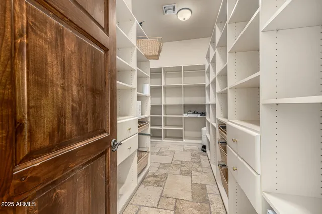 a living room with furniture wooden floor and a fireplace