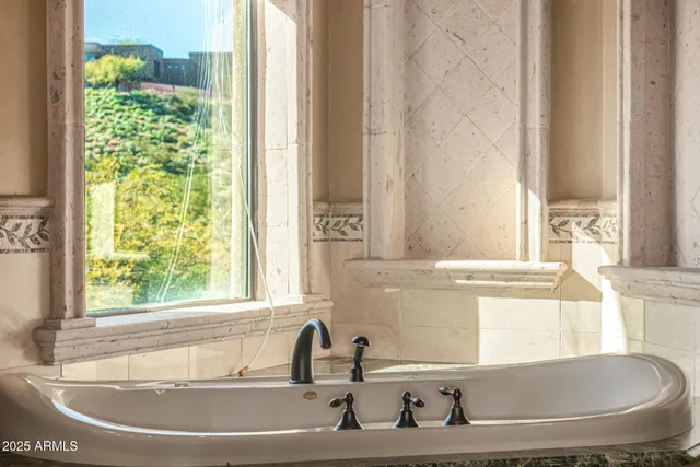 a view of a hallway with wooden floor and a living room