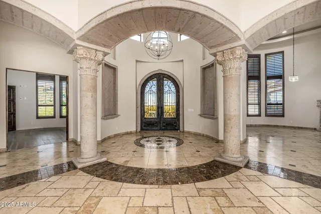 a spacious bedroom with a large bed and a couch