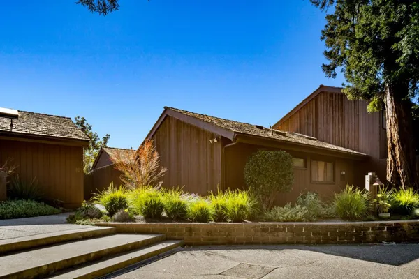 a view of a house and a yard