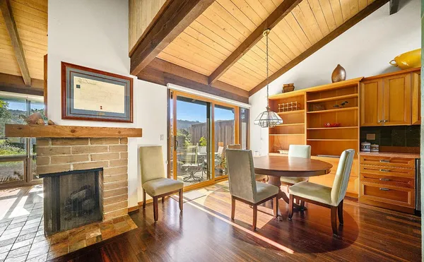 a view of a livingroom with furniture window and wooden floor
