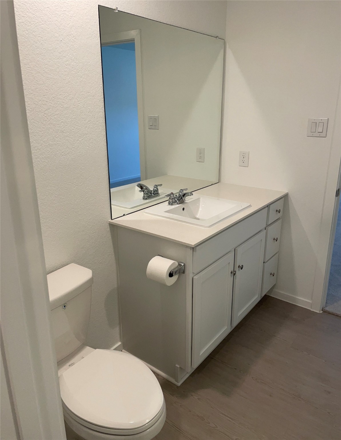 1391 Diamond Carnation Drive Conroe, TX 77301 - Photo 18 of 26 a bathroom with a sink a toilet and mirror