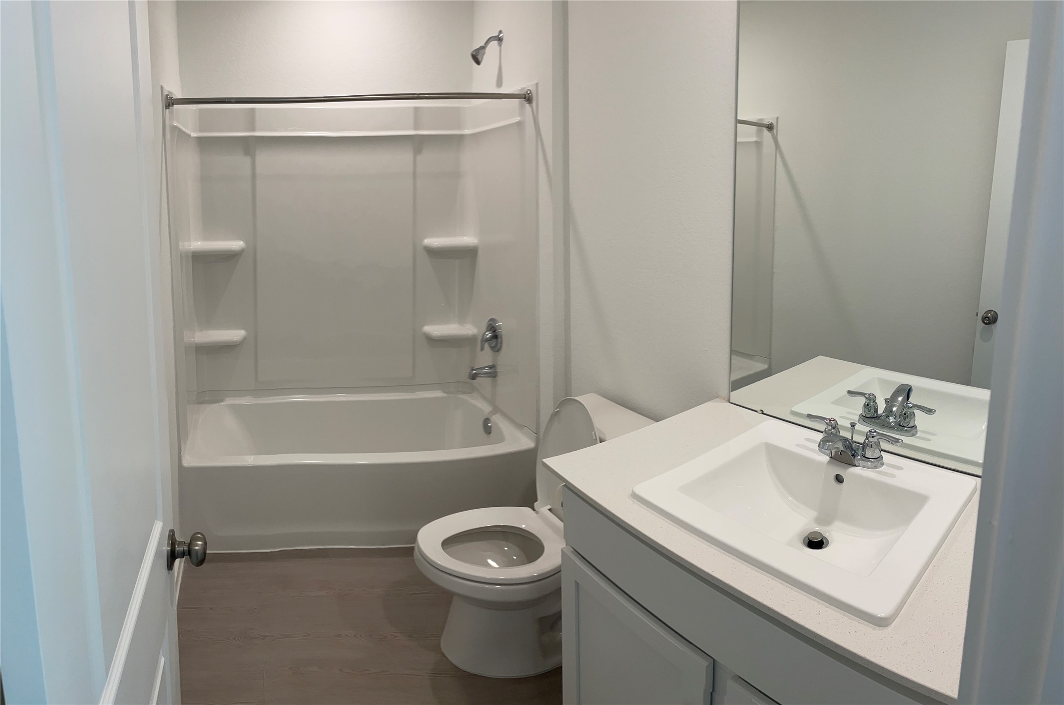1391 Diamond Carnation Drive Conroe, TX 77301 - Photo 23 of 26 a bathroom with a sink mirror toilet and bathtub