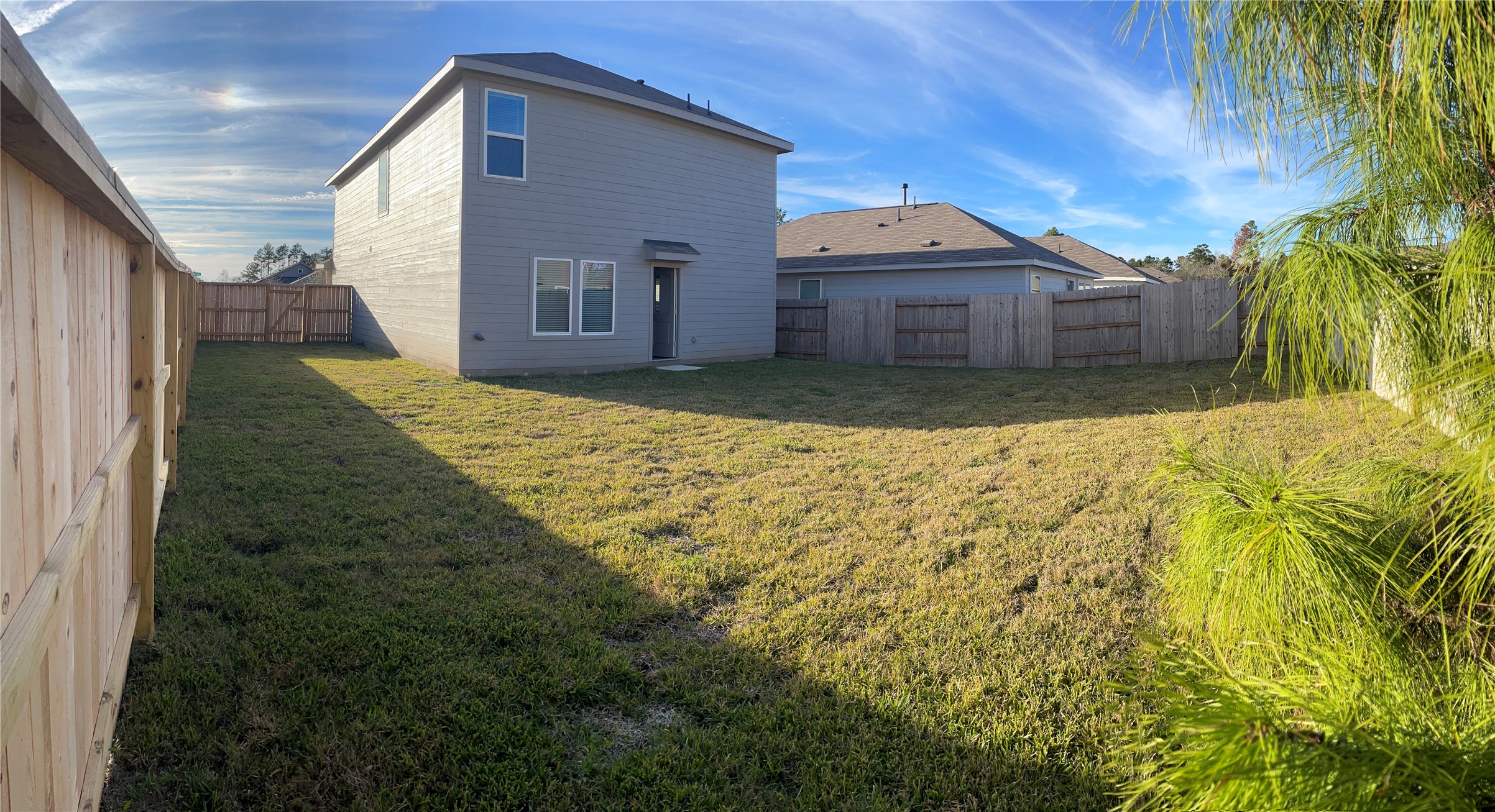 1391 Diamond Carnation Drive Conroe, TX 77301 - Photo 25 of 26 a front view of a house with a yard