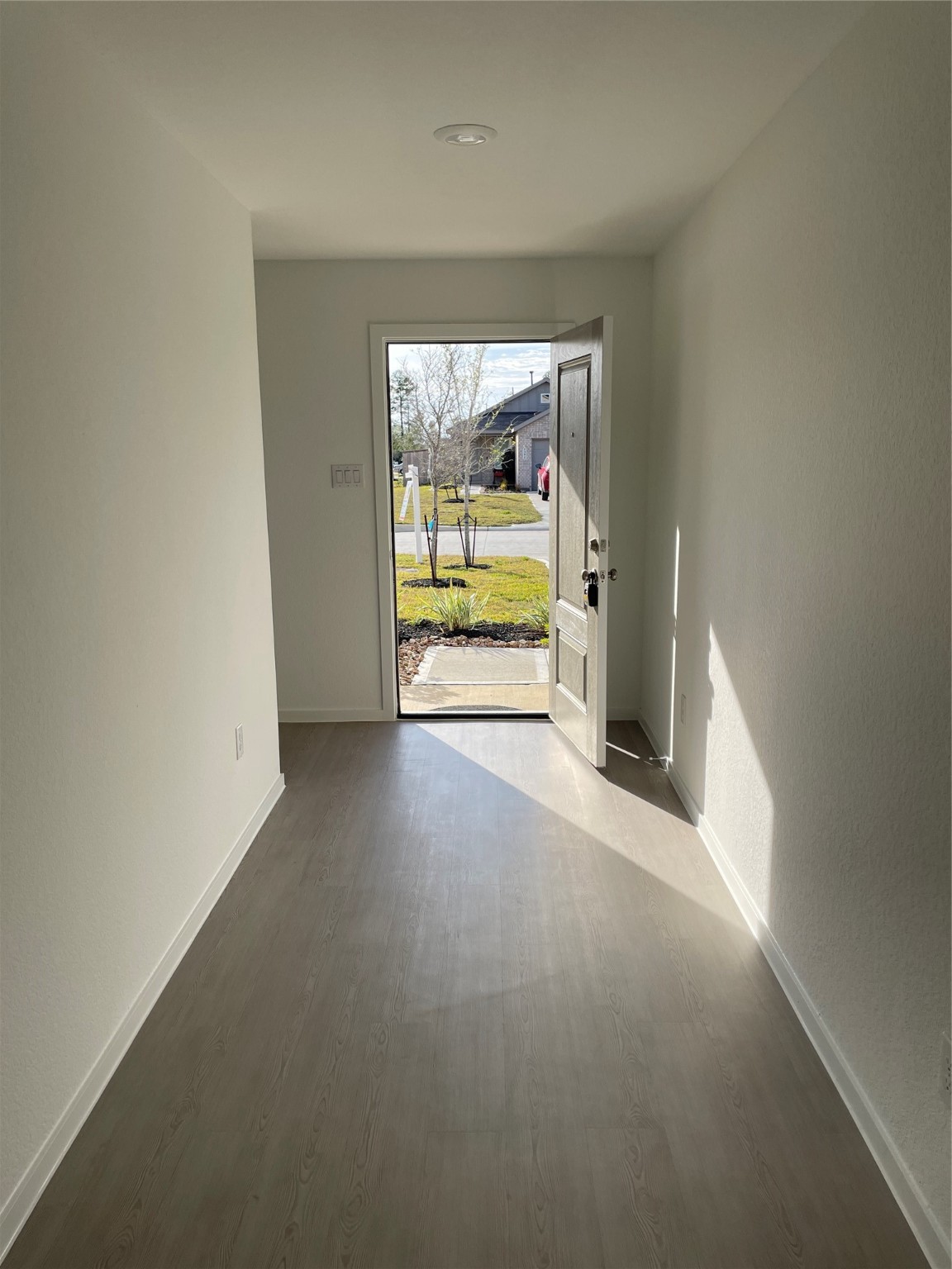 1391 Diamond Carnation Drive Conroe, TX 77301 - Photo 3 of 26 an empty room with a fireplace and windows