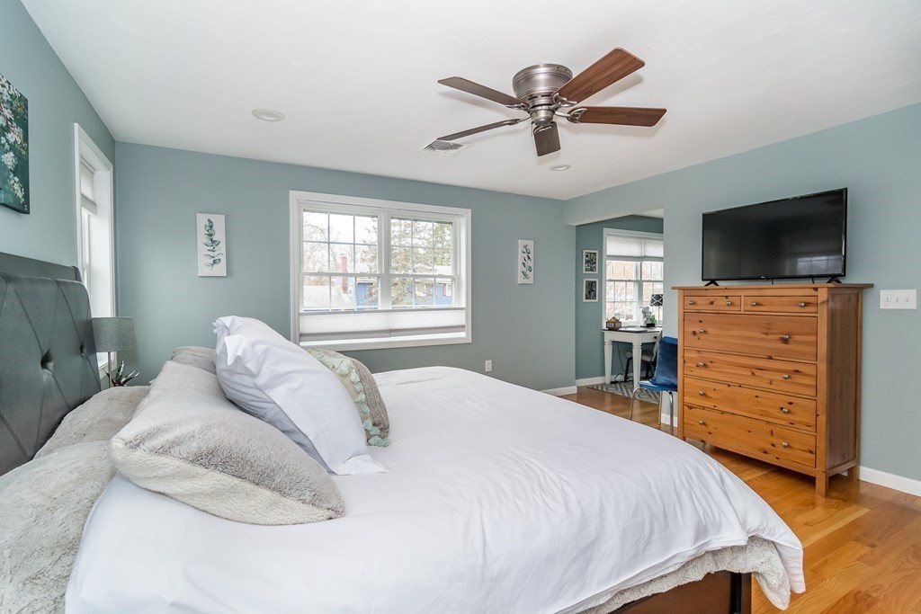 15 Sheffield Road Natick, MA 01760 - Photo 14 of 30 a bedroom with a bed and flat screen tv
