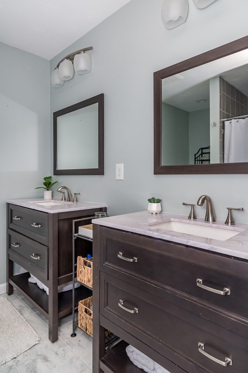15 Sheffield Road Natick, MA 01760 - Photo 20 of 30 a bathroom with a sink double vanity and a mirror