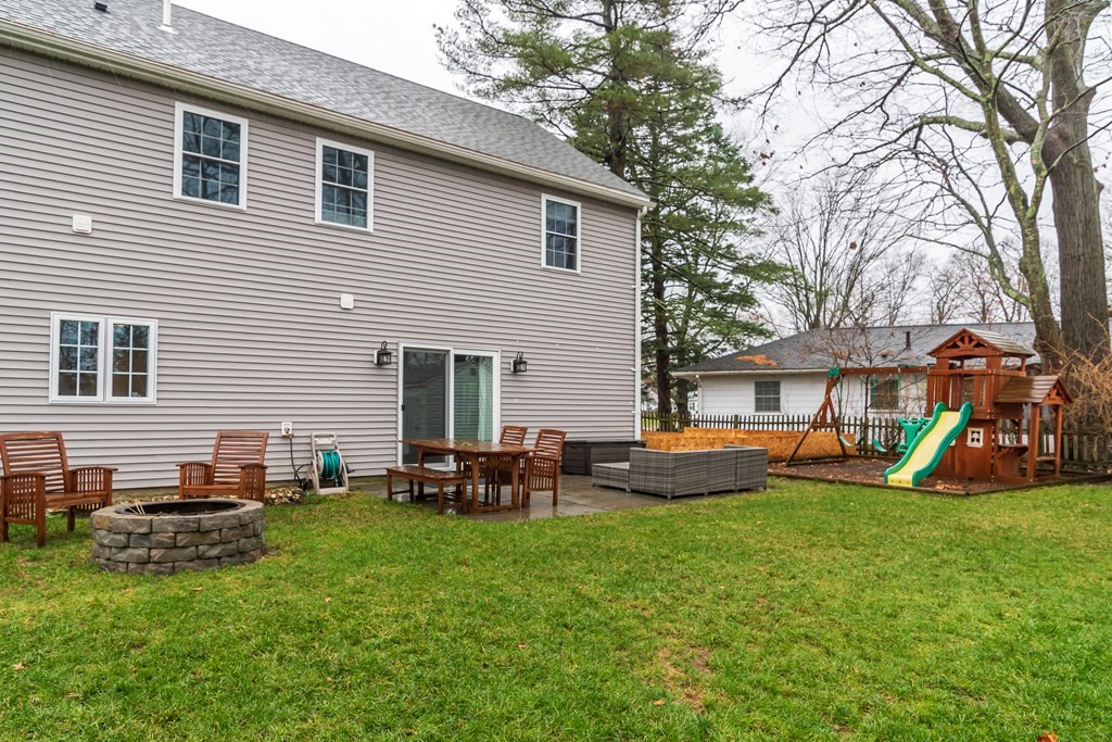15 Sheffield Road Natick, MA 01760 - Photo 27 of 30 a view of a house with a backyard and a tree