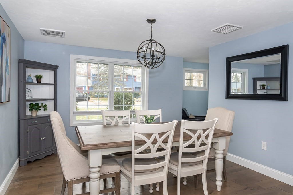 15 Sheffield Road Natick, MA 01760 - Photo 6 of 30 a view of a dining room with furniture wooden floor and a chandelier