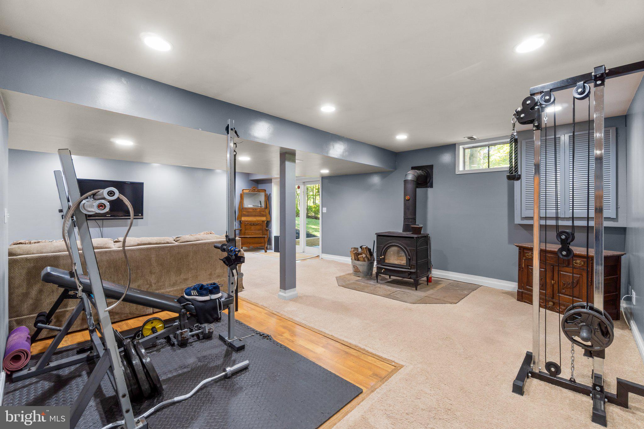 12272 Weller Road Monrovia, MD 21770 - Photo 31 of 46 Walk-Out Lower Level with Wood-Burning Stove